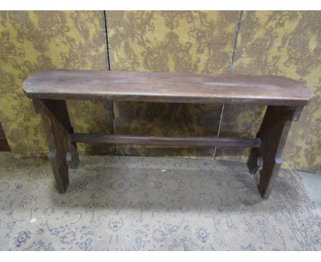 A Victorian pitch pine bench with Gothic tracery outline, 140cm long x 65cm high 