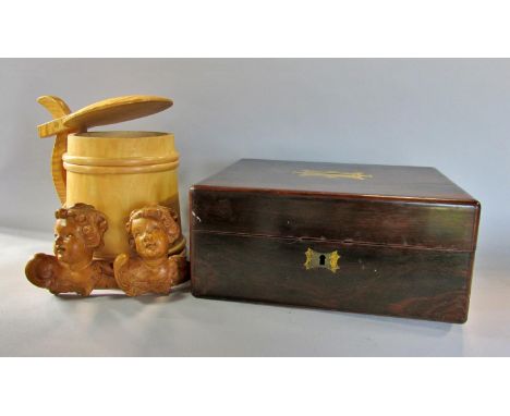 A Dutch satin wood hand made tankard with a peg hinge lid, a pair of oak carved cherub heads and a 19th century mahogany jewe