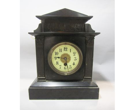 A Victorian black slate mantle clock of architectural form with eight day timepiece 