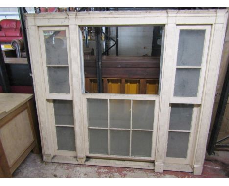 A pair of Georgian pine casement windows, each enclosing three pairs of sash window frames within reeded supports, 181 cm hig