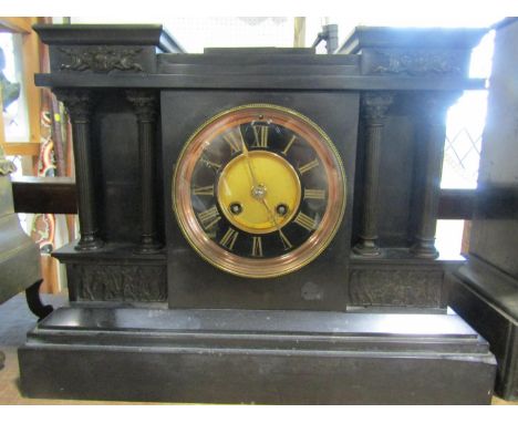 A Victorian black slate mantle clock in a classical architectural theme with eight striking movement 