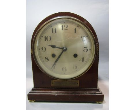 A mahogany mantle clock with arched case with chequered string inlaid detail, eight day striking movement 