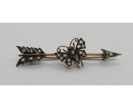 Victorian rose cut diamond set arrow brooch with central butterfly, in yellow metal with white metal setting, 5.5cm W approx,