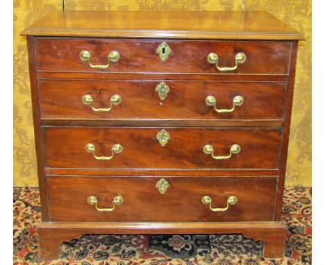 A small Georgian mahogany chest of four long graduated drawers with bracket supports and brass fittings, the top crossbanded 