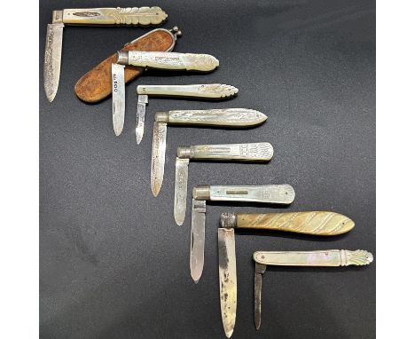 A collection of eight mother of pearl and silver fruit knives, various makers, one in a leather clip purse 