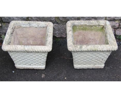 A pair of painted and weathered cast composition stone lattice basket planters of square tapered form, 33cm square x 27cm tog