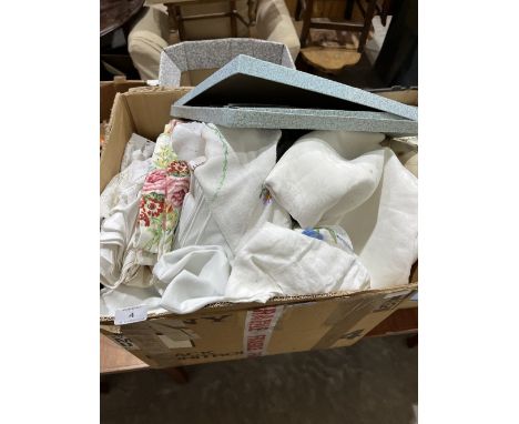 A box of table linen and other textiles