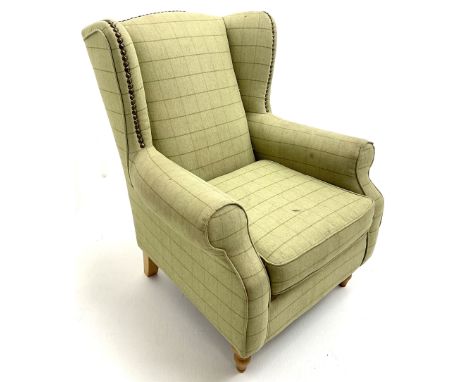 Next Sherlock wingback armchair upholstered in a light green chequered fabric, turned supports Dimensions: Length/Width:&nbsp