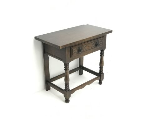 20th century oak side table fitted with carved single drawer, real stile supports and front turned supports Dimensions: Heigh