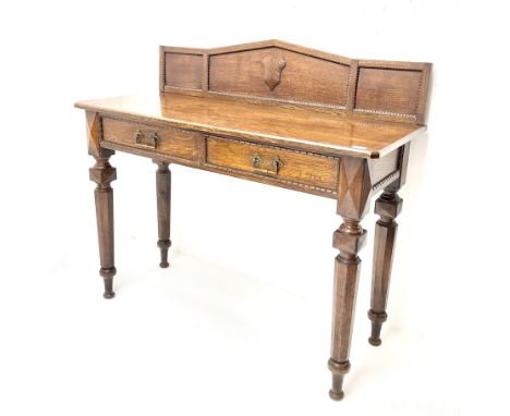 Late Victorian oak side/console table, raised arched back with beaded detail and applied shield shaped mount, rectangular cha