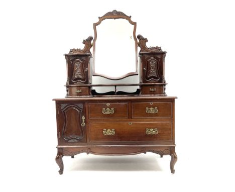 Unusual late Victorian mahogany dressing table, raised shaped bevelled mirror back, two carved trinket cupboards above four s