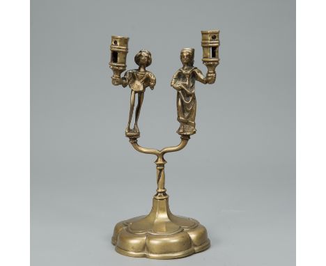 German Candle Stick, with two branches and two spouts, decorated with male and female servants in gothic manner, bronze cast 