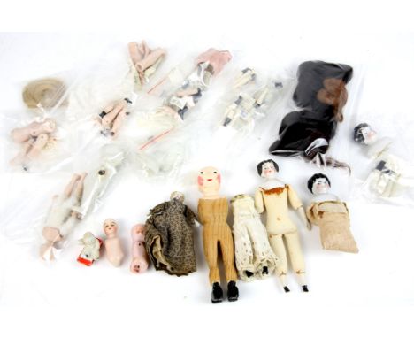 Small dolls porcelain body parts, to include heads, arms, legs and hair, two complete dolls with cloth bodies, porcelain head