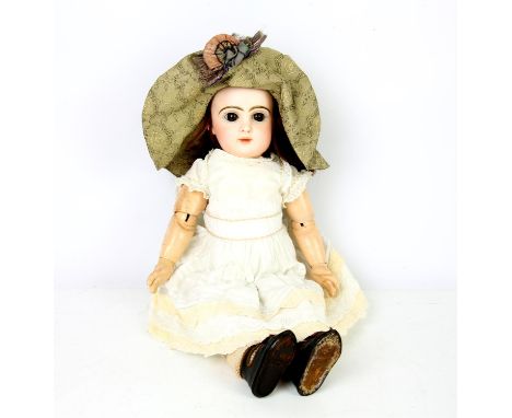 Tete Jumeau bisque headed doll, printed mark to the back of the head, with open brown eyes and closed mouth, hat, dress and s