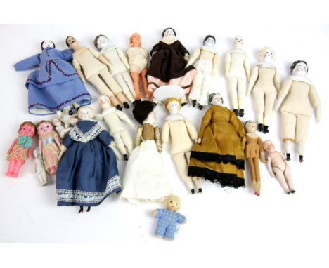 Twenty-two 19th century and later porcelain, wood and plastic small dolls with cloth bodies, some clothed, (22),
