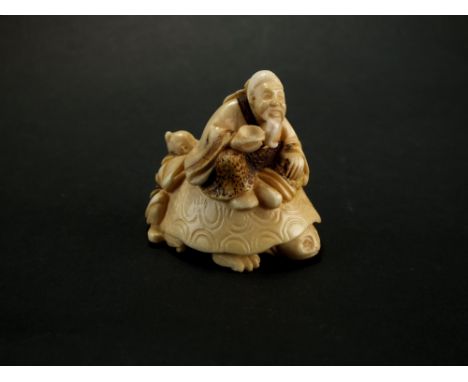 A Japanese ivory netsuke, Meiji/Taisho era, modelled as an immortal with attendant seated on a giant turtle, signed, 4cm high