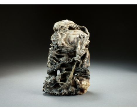 A grey and black jade carving of five dragons, 19th/20th Century, modelled chasing flaming pearls around a vessel amid clouds