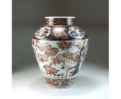 A Japanese Imari porcelain vase, Meiji era, of ovoid form and decorated with a continuous garden landscape between panel bord