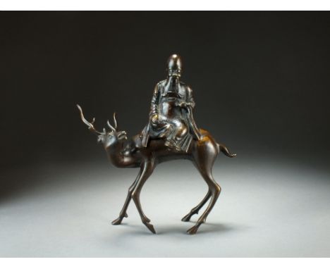 A Chinese bronze figural incense burner, Qing Dynasty, separately cast after the Ming as Shoulao seated on a stag, the beast'