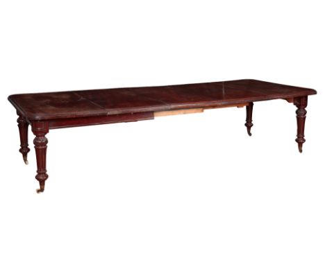 A VICTORIAN MAHOGANY EXTENDING DINING TABLE 19th century, the rectangular top with moulded edge, over a plain frieze, on turn