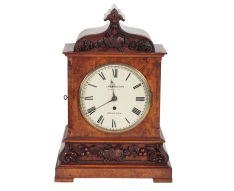 A VICTORIAN WALNUT MANTLE CLOCK the 19cm painted dial, inscribed " Lawson &amp; Son Old Steine Brighton", with single fusee m