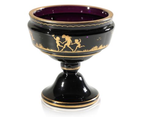 A SMALL BLACK AMETHYST PEDESTAL VASE WITH OVERLAID GILT DECORATION OF CHILDREN FROLICKING c. 1900, probably Buquoy'sche Glash