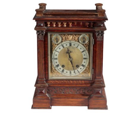 A VICTORIAN OAK MANTEL CLOCK with quarter-striking movement by Winterhalder &amp; Hofmeier, the brass dial with silvered chap