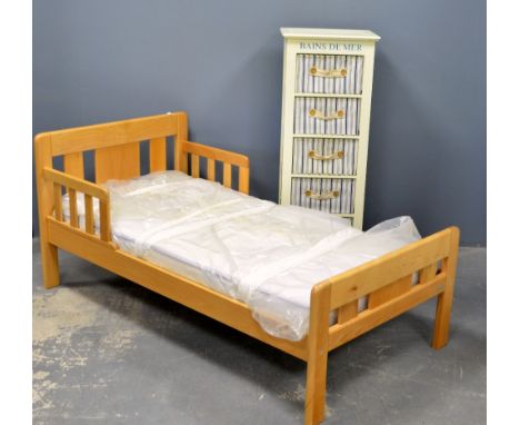 Beech framed childs bed and a painted unit with five baskets