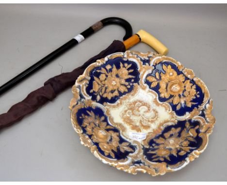 Ivory handled walking cane and an ebonised walking stick with white metal mount. and a Meissen blue and gilt dish