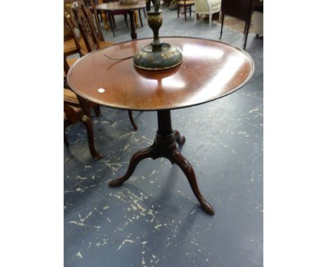 A GEORGIAN MAHOGANY TILT TOP TRIPOD TABLE, THE DISHED CIRCULAR TOP ABOVE LONG NOSED CLUB FEET.   Dia. 75.5 x H 74cms.