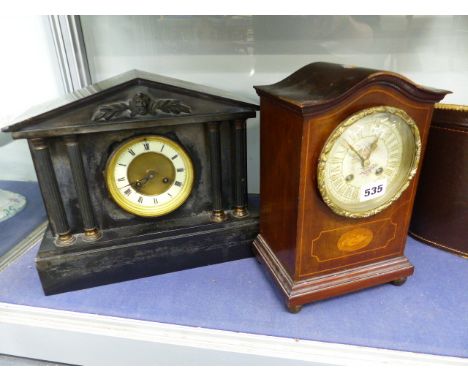 A VICTORIAN BLACK SLATE MANTLE CLOCK, AN EDWARDIAN MANTLE CLOCK AND A PAIR OF PHILO 10 x 50 BINOCULARS.  (3)