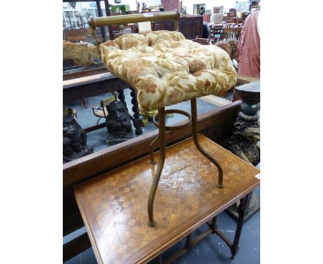 TWO LATE VICTORIAN IRON AND BRASS MUSIC STOOLS BOTH WITH BUTTON UPHOLSTERED SEATS, BRASS RAIL BACKS, ONE WITH THREE TUBULAR L