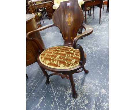 AN EDWARDIAN MAHOGANY DESK CHAIR, THE CARTOUCHE BACK INLAID WITH A VASE OVAL, THE CABRIOLE LEGS JOINED BY A STRETCHER.