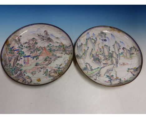 A PAIR OF CANTON ENAMEL DISHES PAINTED WITH FIGURES IN MOUNTAINOUS ISLAND SCENES.   Dia. 26.5cms.