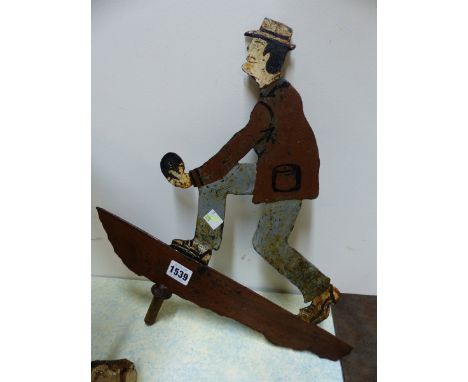 A PAINTED IRON WEATHER VANE, THE SHEET CUT OUT TO REPRESENT A MAN PLAYING BOWLS.   40 x 36cms.