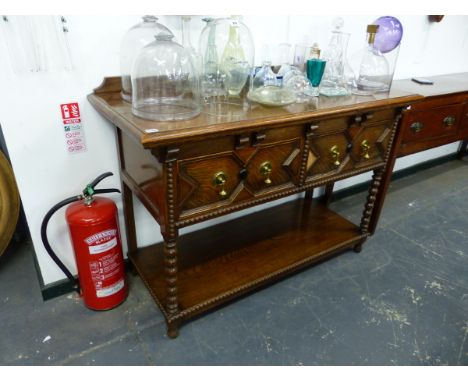 AN EARLY 20th.C.OAK POTBOARD DRESSER BASE WITH TWO DRAWERS ON BOBBIN TURNED LEGS.   130 x 56 x H.86cms.