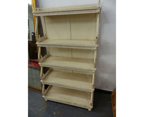 AN ANTIQUE STYLE PAINTED WATERFALL BOOKCASE WITH SHAPED SHELF SUPPORTS.   89 x 42 x H.160cms.