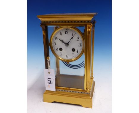 A FRENCH GILT METAL MOUNTED BEVELLED GLASS CASED MANTLE CLOCK STRIKING ON A COILED ROD, THE ENAMELLED DIAL WITH ARABIC NUMERA