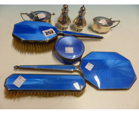 A HALLMARKED SILVER AND ENAMEL DRESSING TABLE SET, TWO SILVER MUSTARDS AND TWO PEPPER POTS.