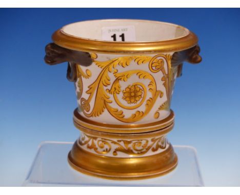 A CHAMBERLAIN'S WORCESTER BROWN MASKED HANDLED PLANTER AND STAND, GILT WITH FOLIAGE SCROLLS.   H.12cms.