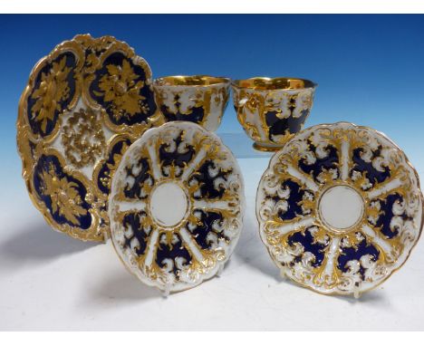 A PAIR OF MEISSEN CUPS AND SAUCERS RELIEF DECORATED WITH BLUE AND GILT PANELS TOGETHER A SIMILARLY DECORATED MEISSEN DISH.   