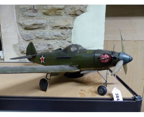 AN AMERICAN WORLD WAR II WAR PLANE, THE THREE BLADED PROP POWERED BY A LIVE FUEL ENGINE, THE WINGSPAN.   69cms. 