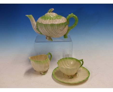 BLACK MARKED BELLEEK TEA WARES, EACH OF THE SHELL SHAPES WITH GREEN RIMS, COMPRISING A TRAY, A SANDWICH PLATE, FOUR TEA PLATE