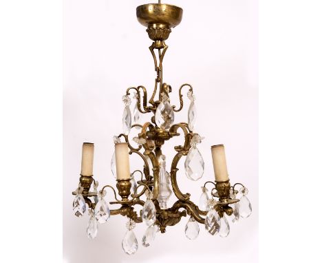 A 20TH CENTURY FIVE BRANCH CEILING LIGHT with cut glass drops, 52cm approximately