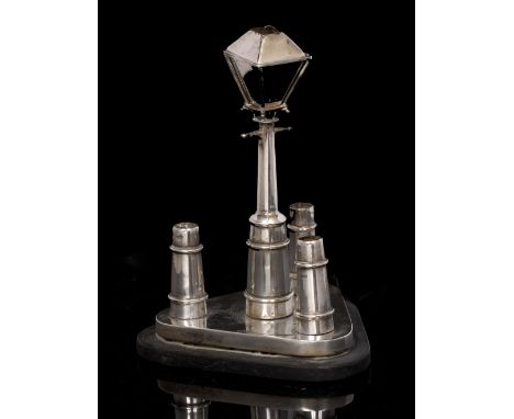 AN UNUSUAL VICTORIAN SILVER CIGAR LIGHTER in the form of a street lamp on a triangular base, with silver spill holders in the