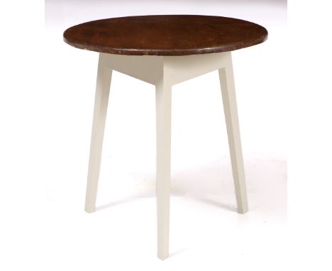 A CIRCULAR CRICKET TABLE with stained pine top and painted tripod base, 69.5cm diameter x 69.5cm high