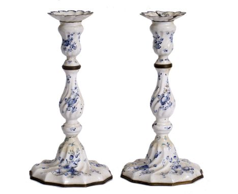 A PAIR OF 18TH CENTURY BILSTON ENAMEL CANDLESTICKS decorated with blue flowers on a white ground and with writhing knopped st