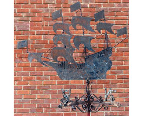 A MID 20TH CENTURY WROUGHT IRON WEATHER VANE in the form of a three masted galleon, mounted on a stand with scrolling bracket