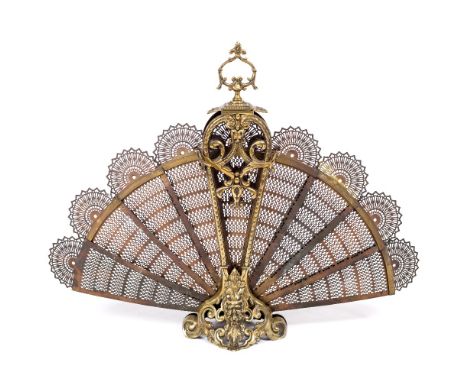 A 20TH CENTURY PIERCED BRASS PEACOCK FIRESCREEN 62cm high x 79cm wide when fully extended