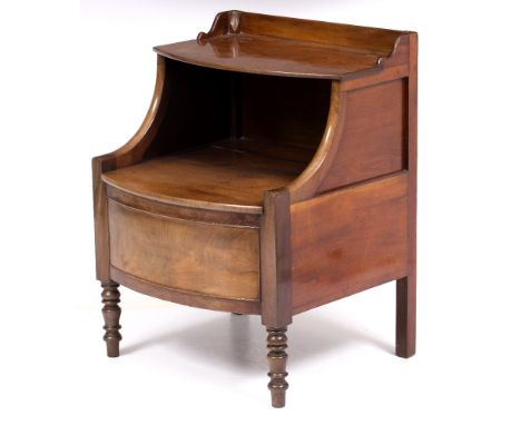 A 19TH CENTURY MAHOGANY BOW FRONTED COMMODE STOOL with lifting top and seat, standing on turned tapering legs, 57cm wide x 54